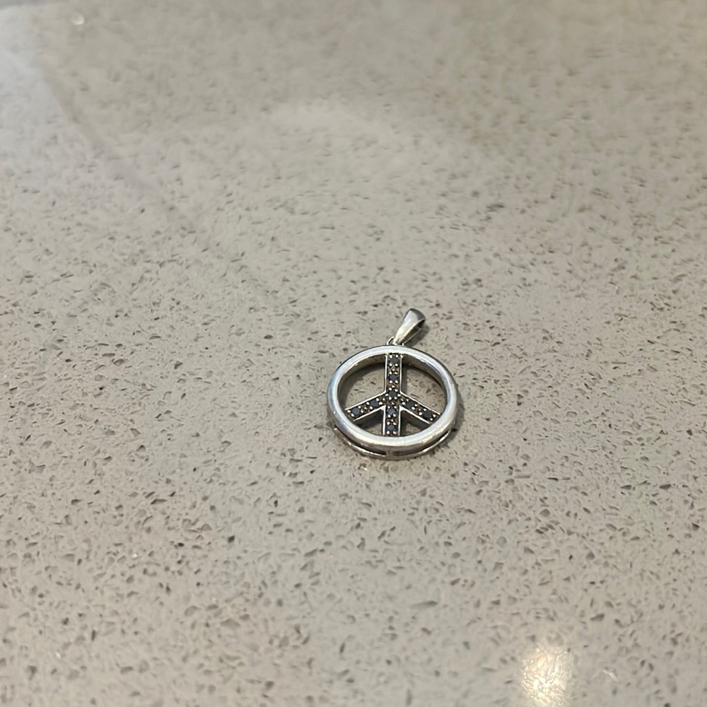 Black diamond peace sign pendant